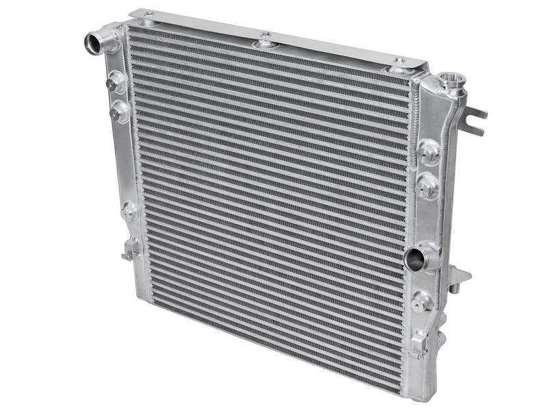 aFe BladeRunner GT Series Bar and Plate Radiator w/ Black Hoses 12-18 Jeep Wrangler (JK) V6 3.6L back side view on Bolt Motorsports